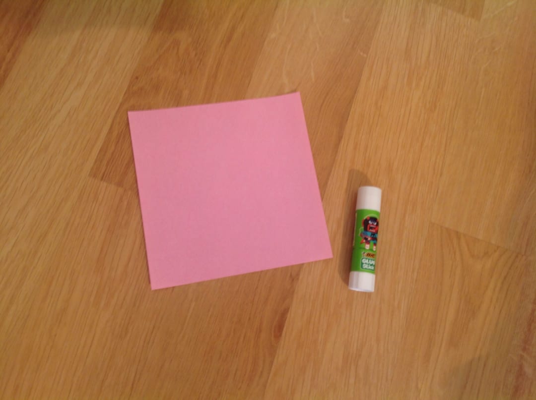 How to fold 人形用の可愛い座布団☆: まずは自分の好きな色の折り紙（どのサイズでも可能です）とスティックのりを用意して下さい。