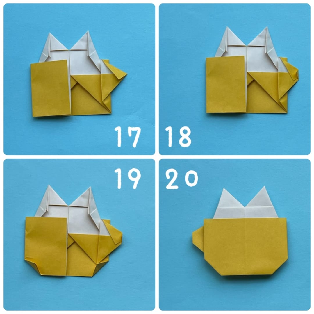 How to fold マグカップネコ＆うさぎ: 17  今折ったところの、右側の頂点と、付け根をつなぐ点で折ります。
18  今折ったところの角を少し折ります。
19  下側の、二つの角も少し折ります。
20  裏返して完成です。
